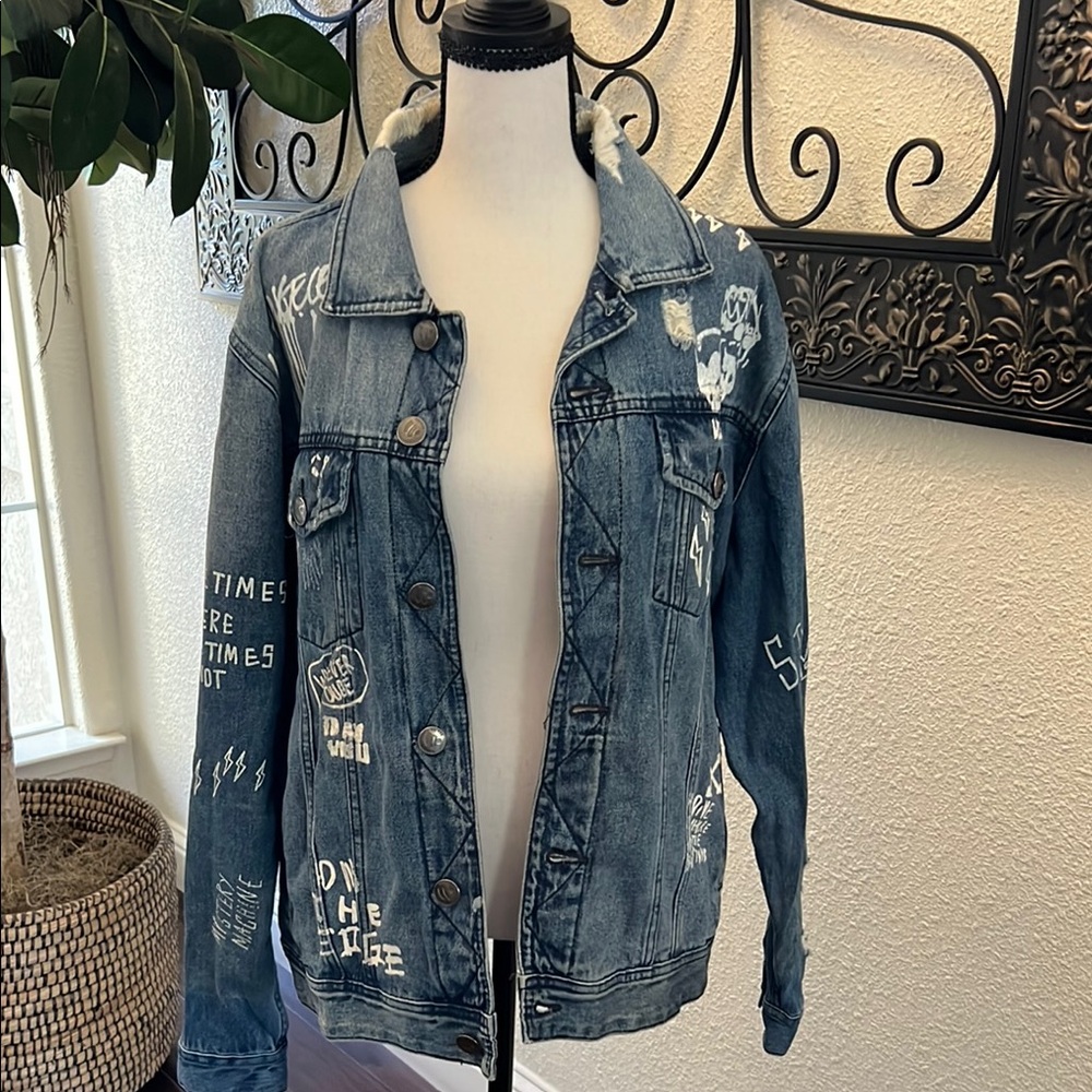 Blue Distressed Jean Jacket with Decorative Patches